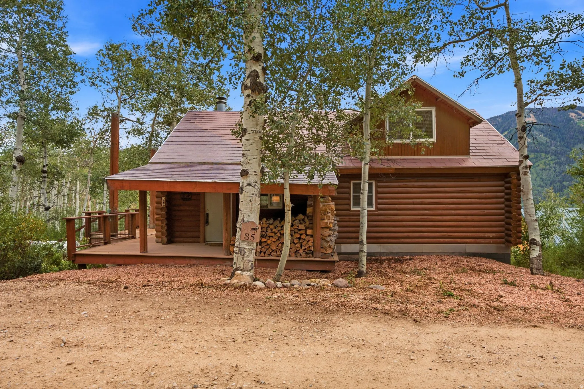 Log cabin exterior with an inviting covered porch