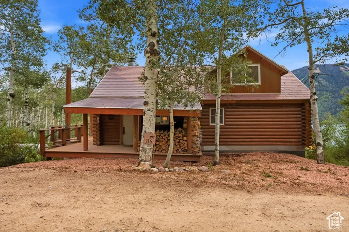 Log cabin exterior with an inviting covered porch