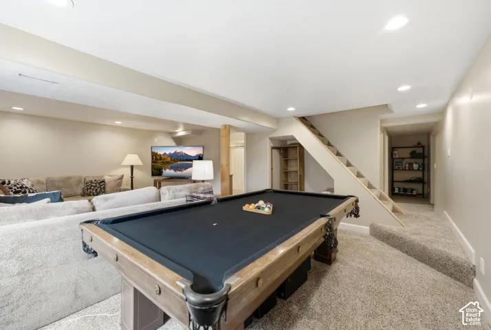 Open recreation area featuring neutral tone carpeting and recessed lighting