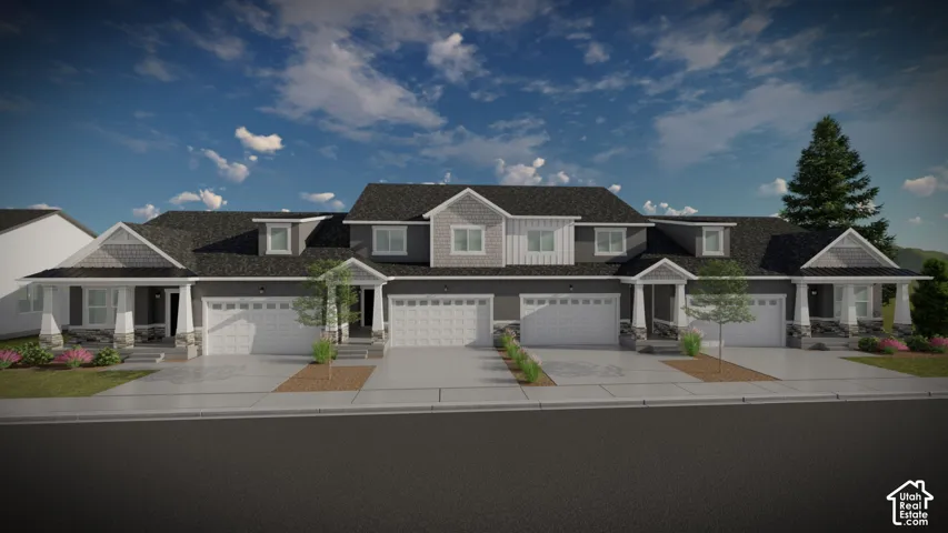 Contemporary townhome community featuring multiple units with coordinated architectural design, two-car attached garages, front-facing landscaping with mature evergreen plantings, and clean-lined exterior finishes in neutral tones with dimensional rooflin