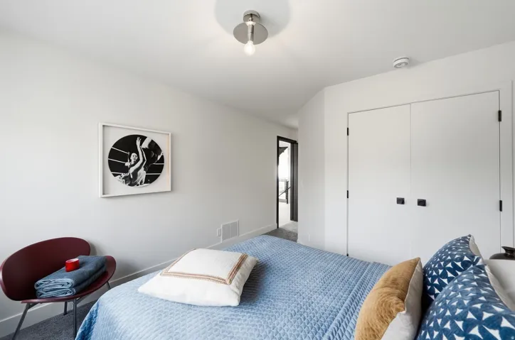 Recessed closet with matte black hardware, flush-mount ceiling lighting, and light-toned wall finishes