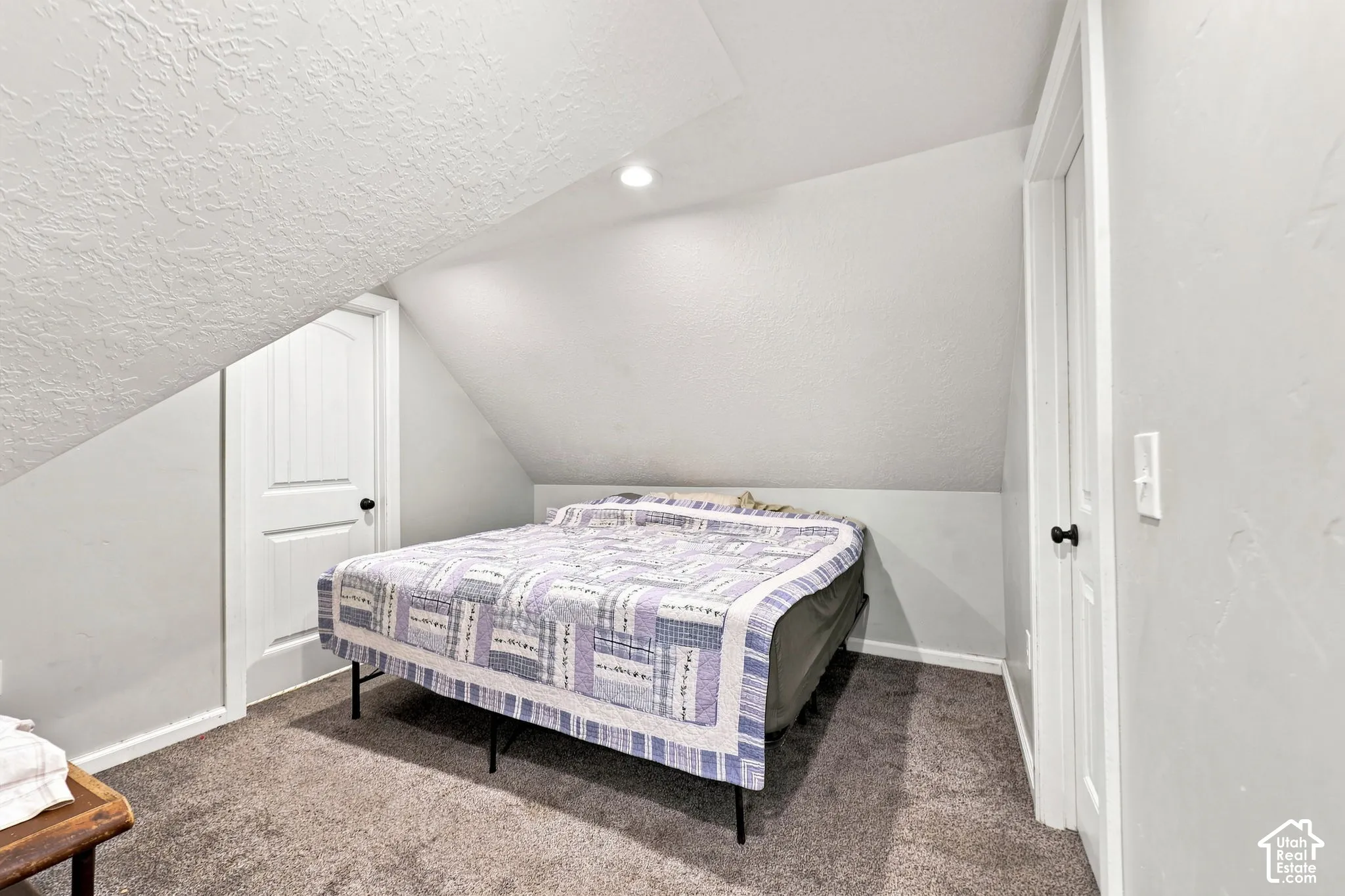 Sloped ceiling design with a recessed light fixture