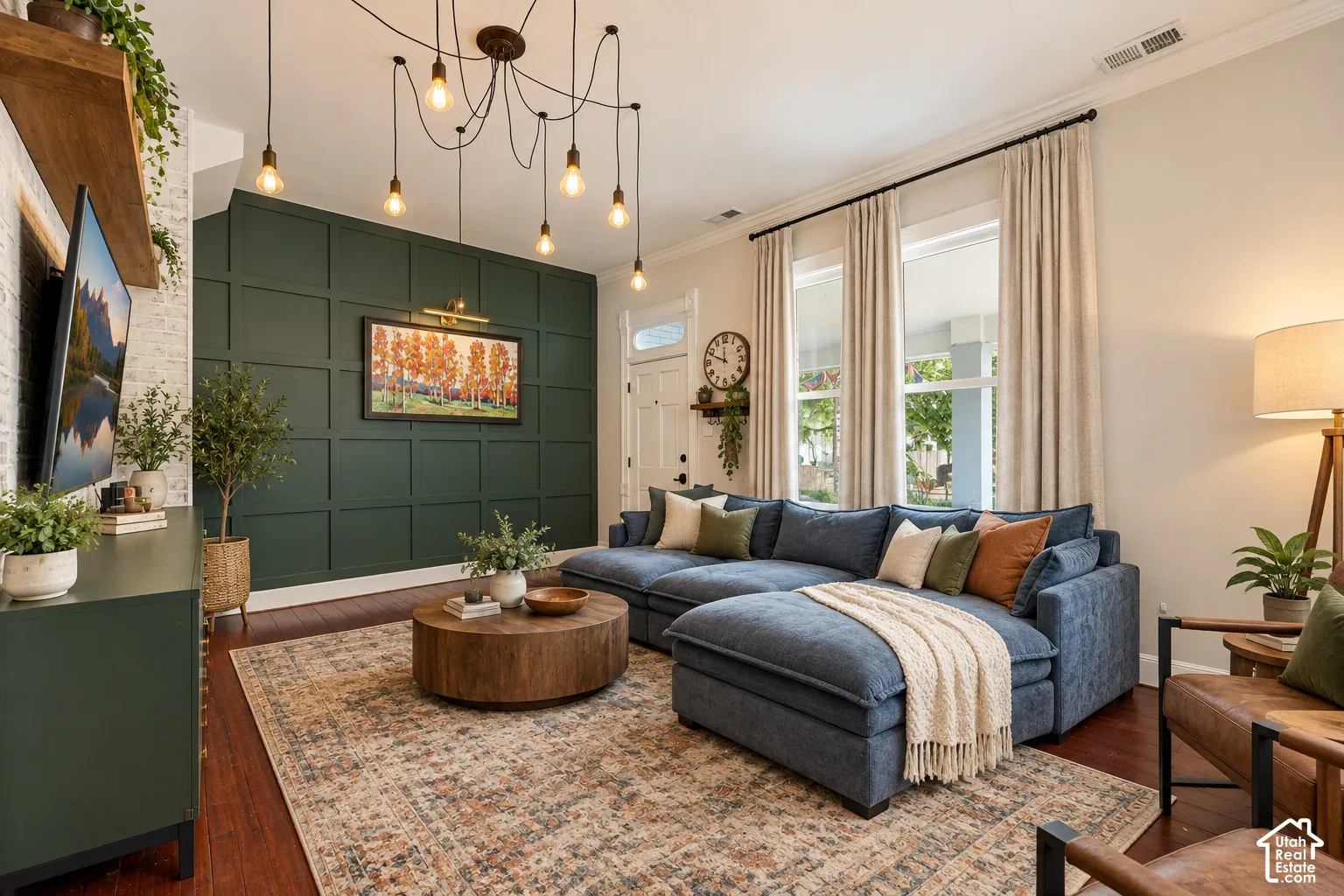Hardwood-style flooring, decorative wall paneling, ceiling-mounted light fixture, recessed lighting, and crown molding