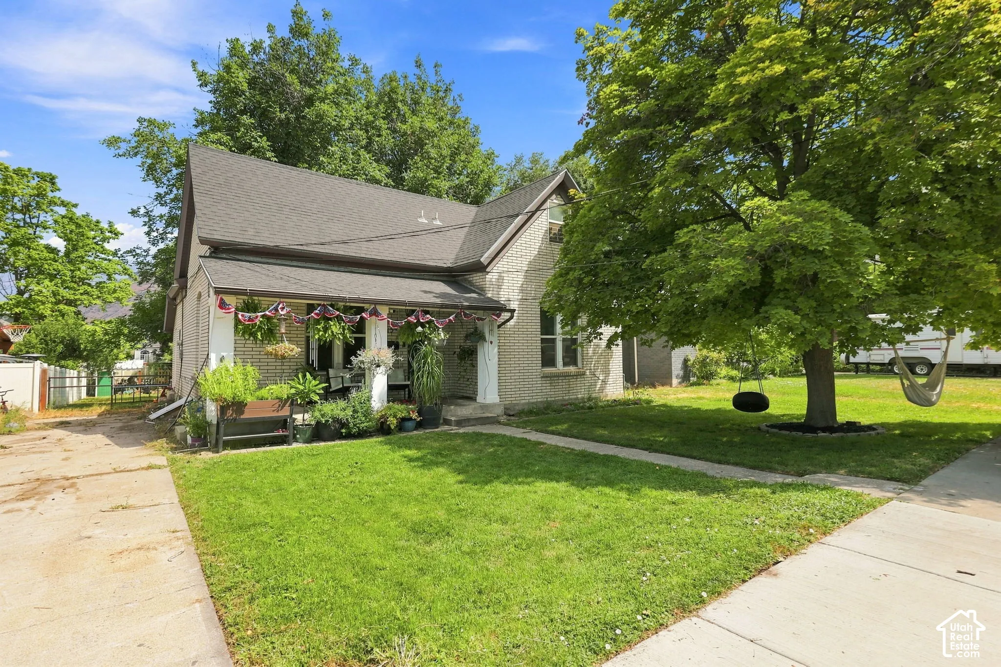 Brick exterior with a covered front porch and gabled roofline