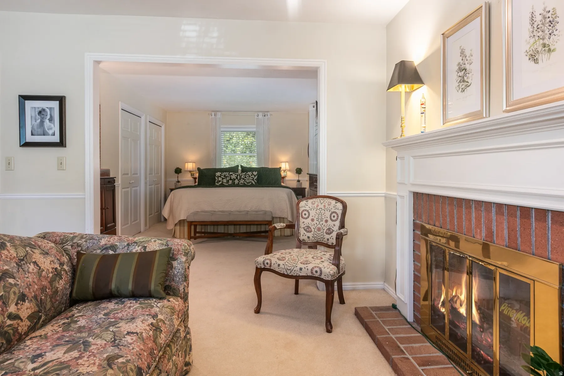Brick fireplace with a white mantel and hearth