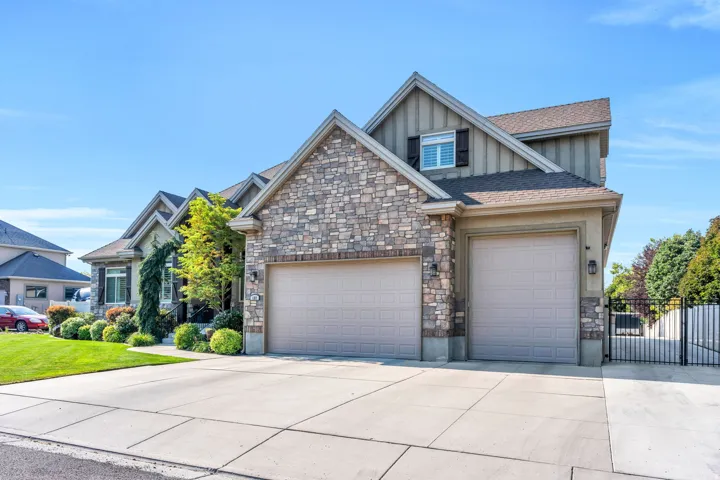 Striking stone and siding exterior with multiple gabled rooflines and architectural detail.