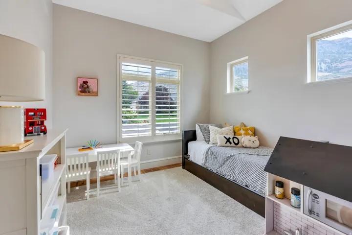 Main floor bedroom with lots of windows for natural light.
