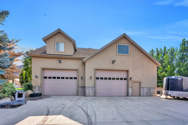 Detached 4 car garage/shop with finished space above.