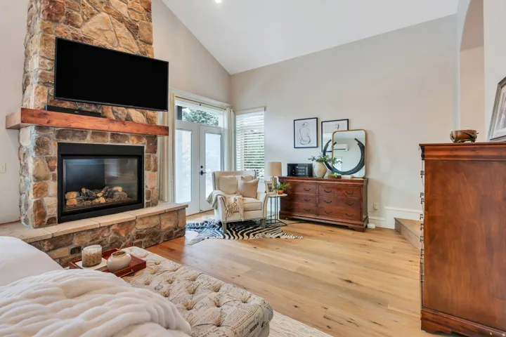 Primary suite with gas fireplace and doors to large back deck.