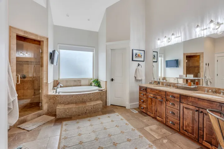 Primary ensuite with double sinks and vanity area.