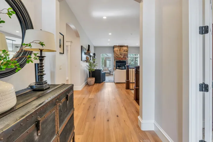 Wood-finish flooring throughout, recessed lighting, and an  hallway entry.