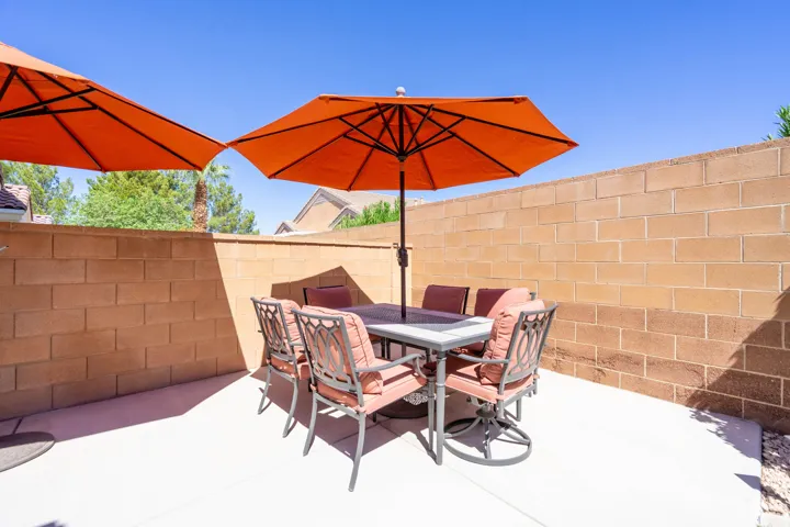 Paved patio area with concrete block walls