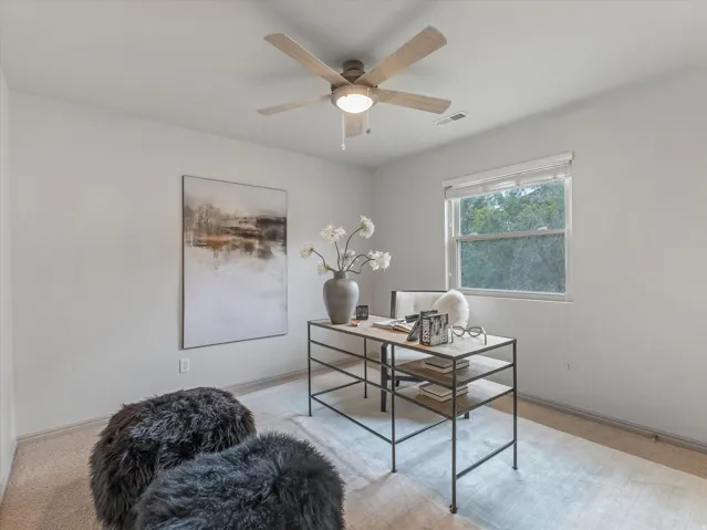 Recessed lighting, ceiling fan with light, and a window with blinds providing natural illumination
