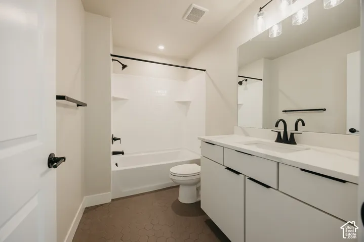 White vanity with a single basin, solid surface countertop, and matte black fixtures