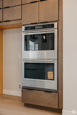 Built-in stainless steel double oven with coordinating cabinetry