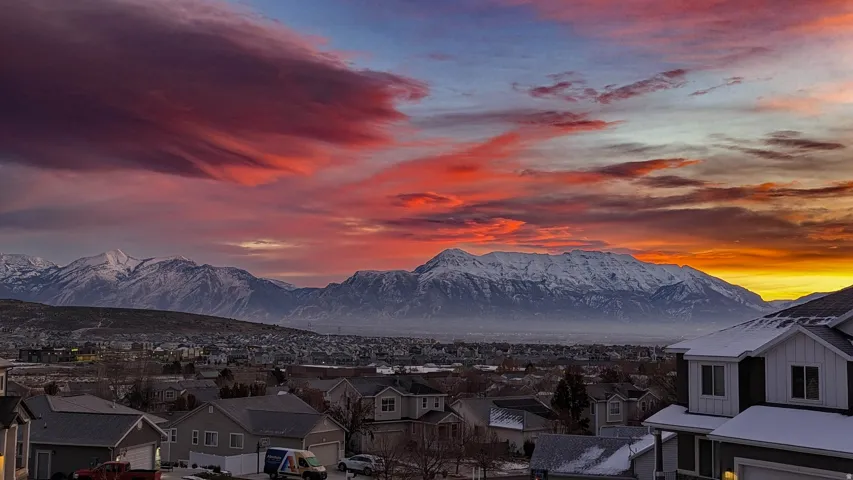Sweeping mountain range backdrop with a dramatic sky