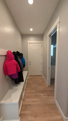 Entryway featuring wood-finish flooring and recessed lighting