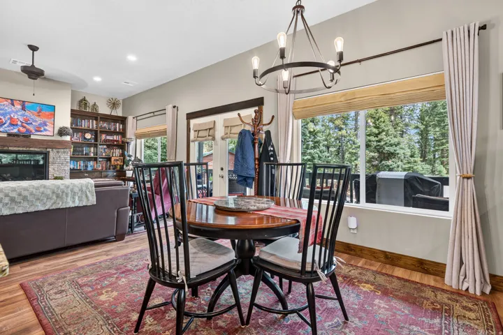 Open-concept living space with wood-finish flooring