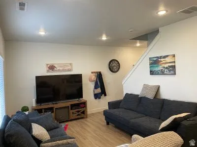Recessed ceiling lighting with wood-finish flooring
