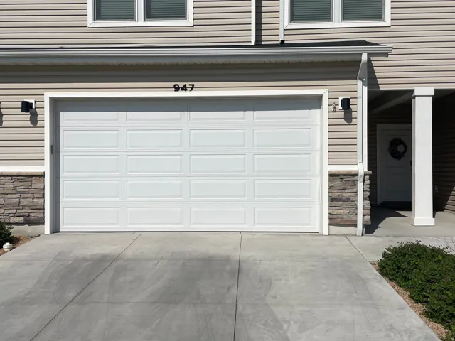 Two-story exterior with horizontal siding and stone veneer accents
