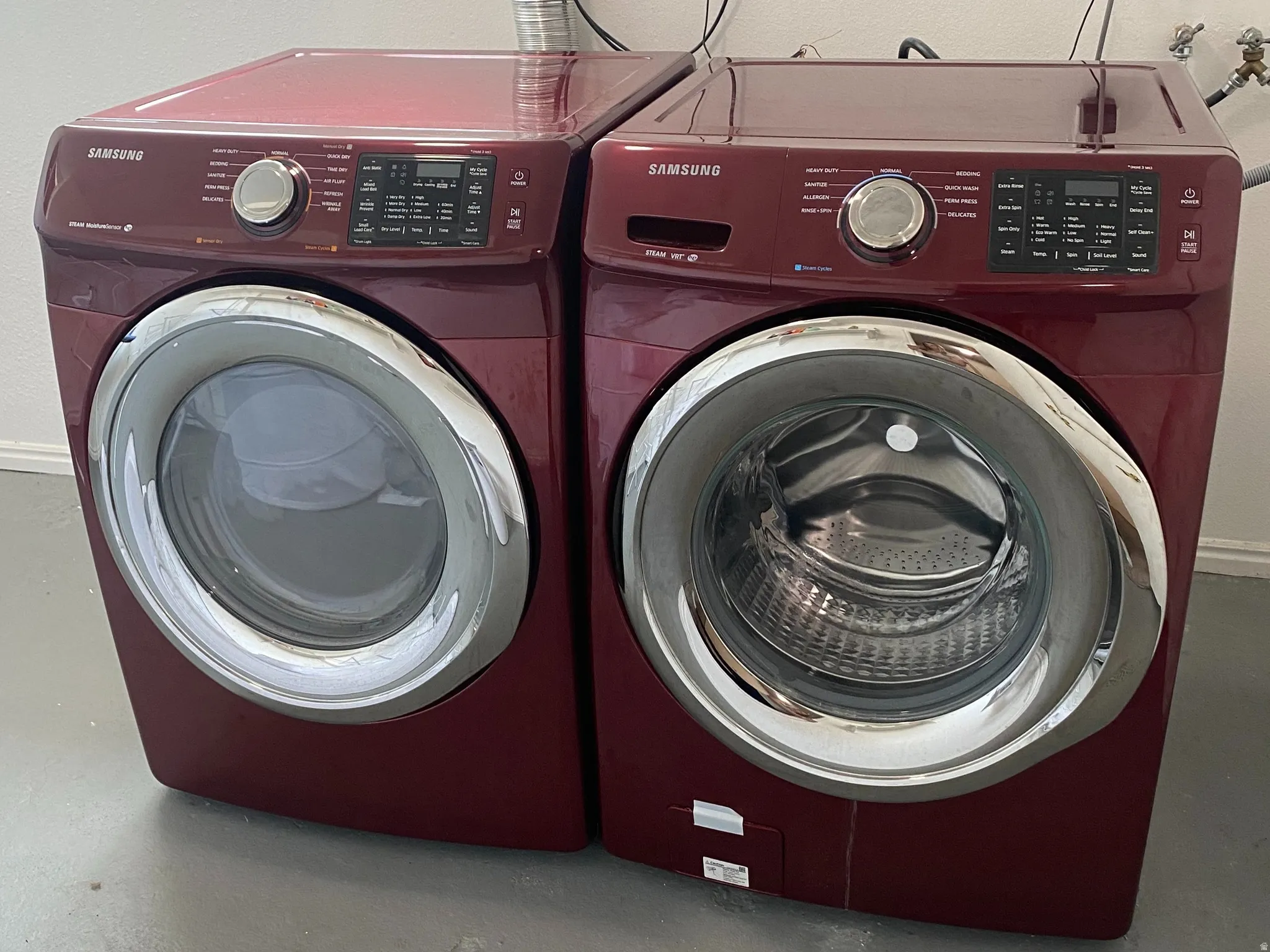 Front-loading washer and dryer set with a concrete floor