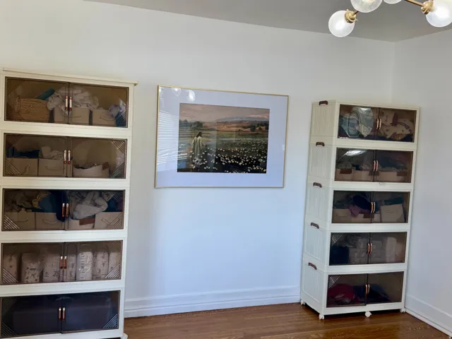 Hardwood flooring throughout featuring a modern ceiling light fixture