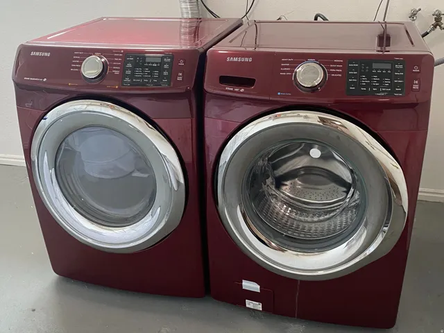 Front-loading washer and dryer set with a concrete floor