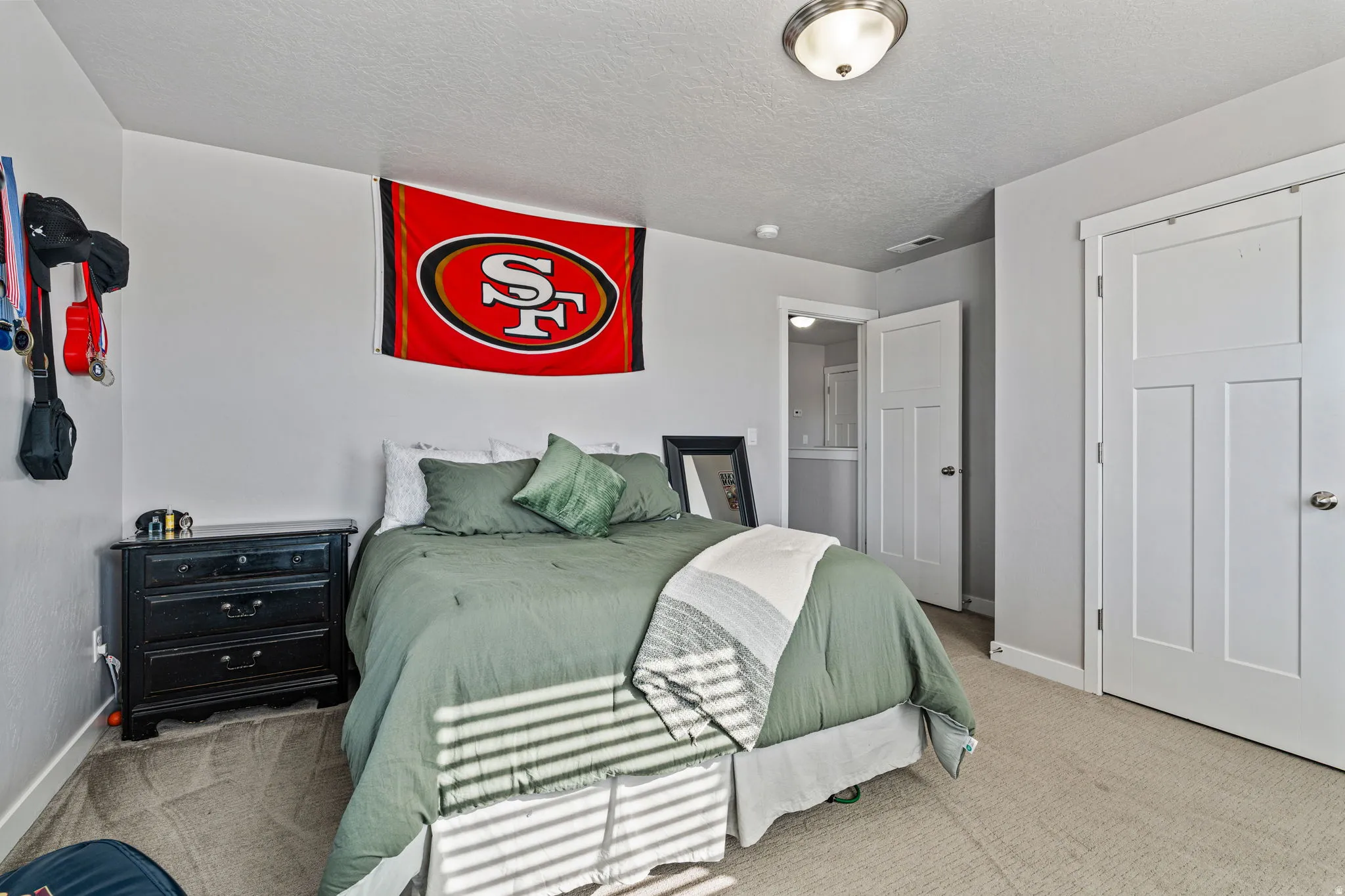 Recessed ceiling lighting, paneled interior doors, and neutral wall paint