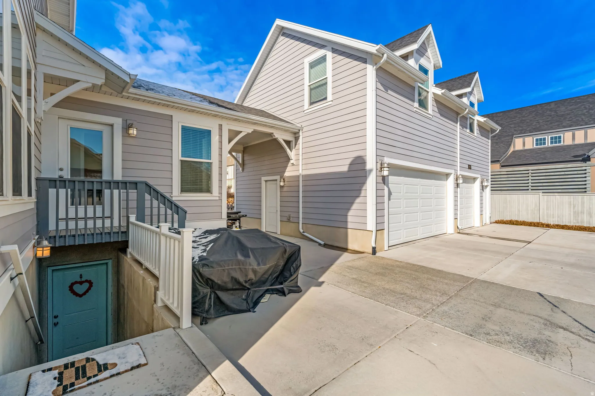 Light gray siding exterior with white trim