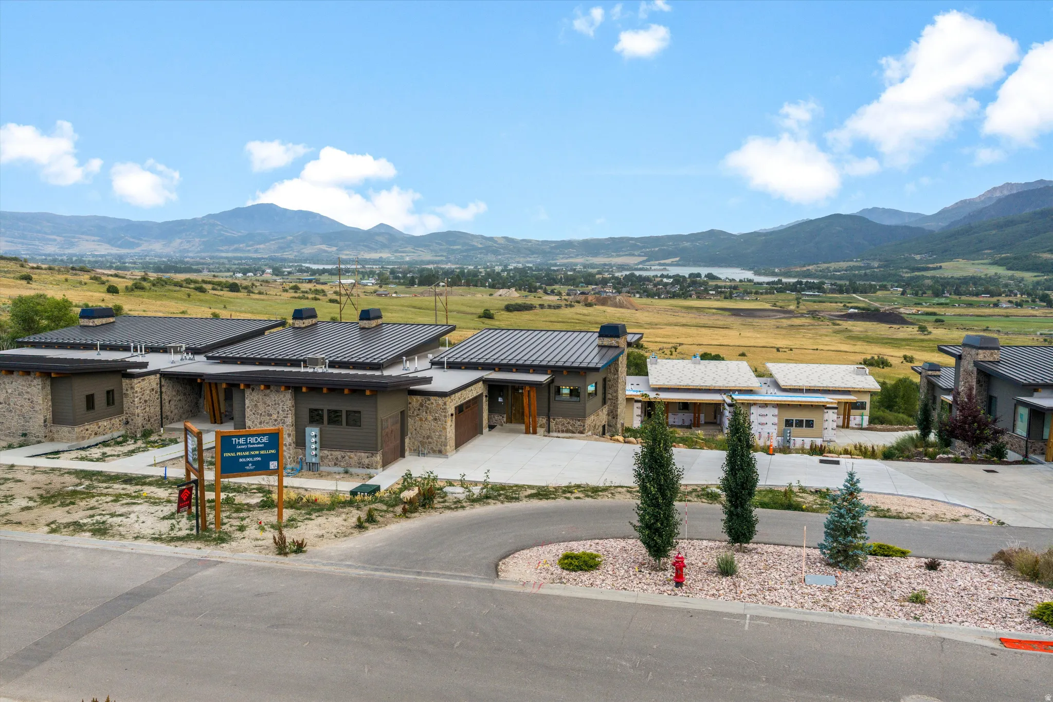 Modern residential property featuring a contemporary stone and stucco exterior with solar panel installation