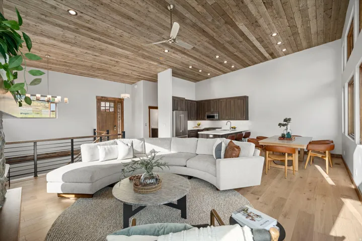 Vaulted wood-paneled ceiling with recessed lighting