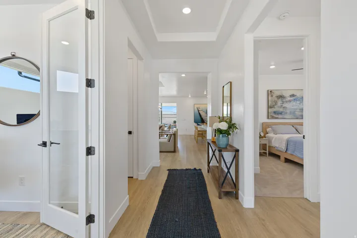 Wood-finish flooring throughout the hallway