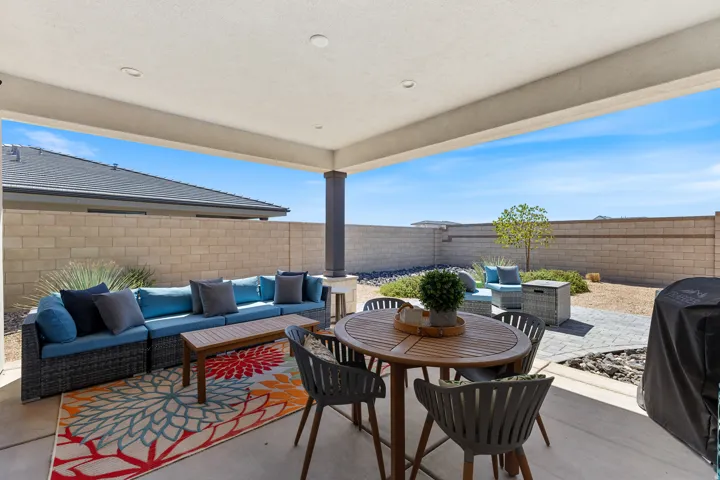 Covered patio with recessed lighting, concrete flooring, and an exterior column