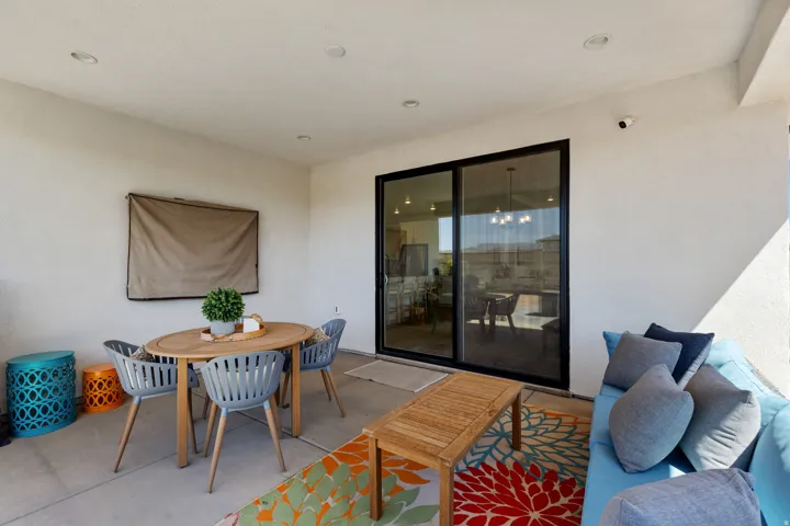 Covered patio with recessed lighting, concrete flooring, and a large sliding glass door
