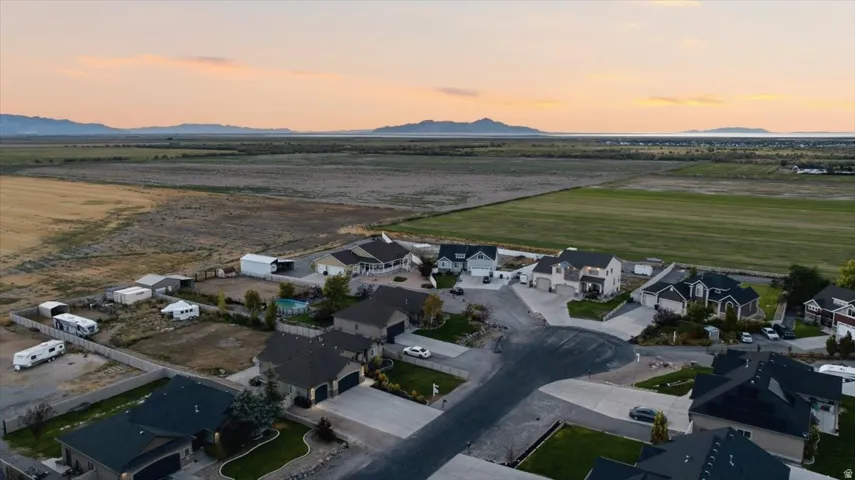 Residential neighborhood setting with distant mountains and open fields