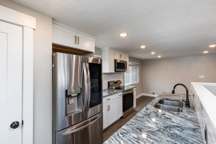 Kitchen with Granite Countertops and Included Stainless Steele Appliances