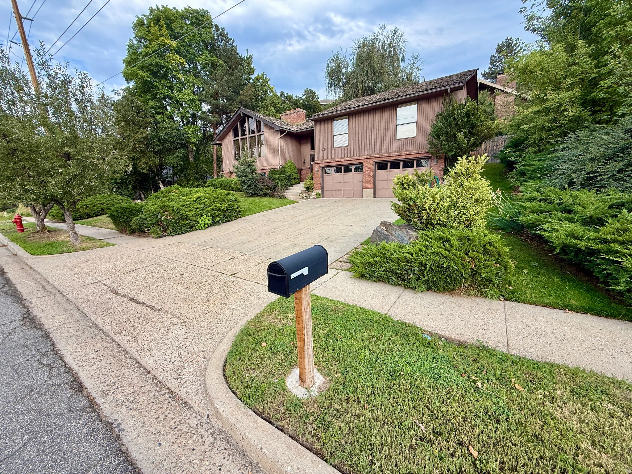 Expansive driveway leading to a two-car garage