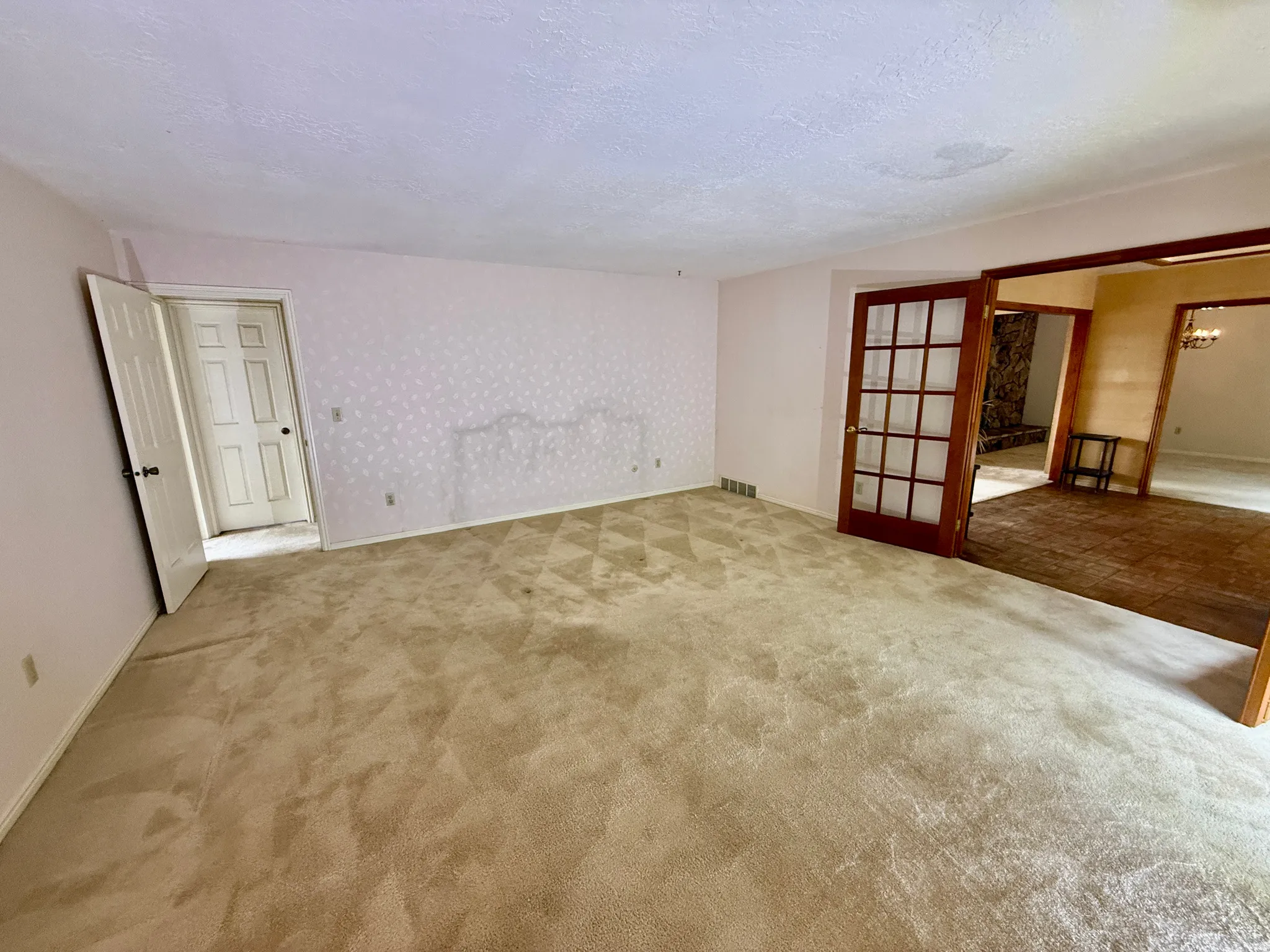 Enormous Master bedroom with sliding glass doors to deck, french doors, double closets, and master bath.