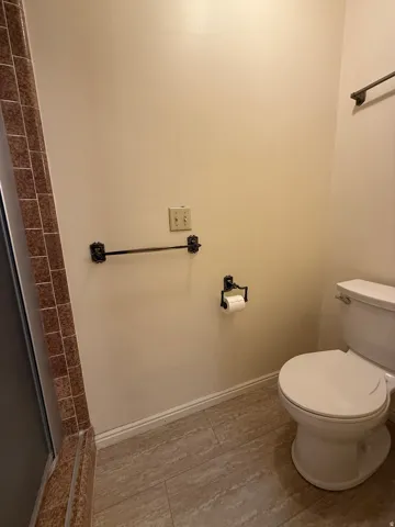 Master Bathroom with his and her closets, double vanity, and walk-in shower.