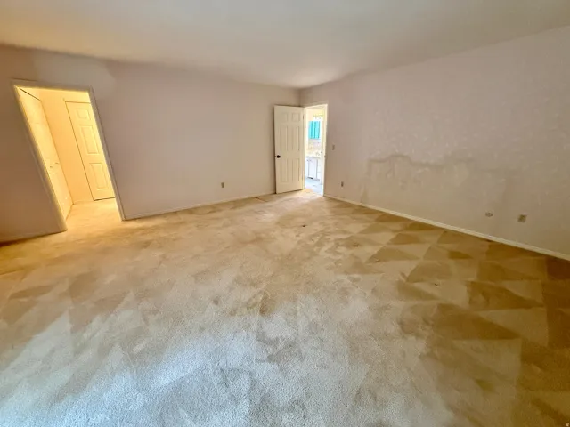 Enormous Master bedroom with sliding glass doors to deck, french doors, double closets, and master bath.
