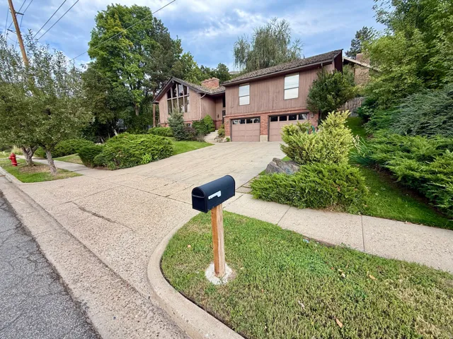 Expansive driveway leading to a two-car garage