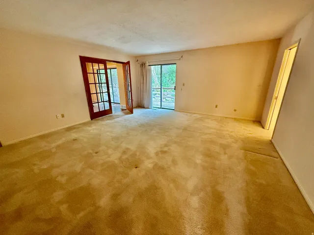 Enormous Master bedroom with sliding glass doors to deck, french doors, double closets, and master bath.