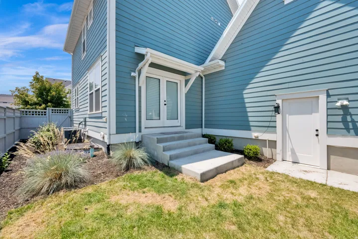 Blue horizontal siding exterior with white trim