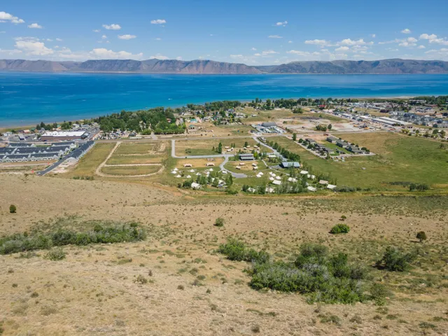 Expansive land parcel featuring natural terrain and distant water body