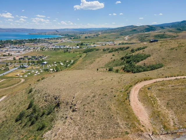 Expansive elevated terrain with a natural landscape and distant water