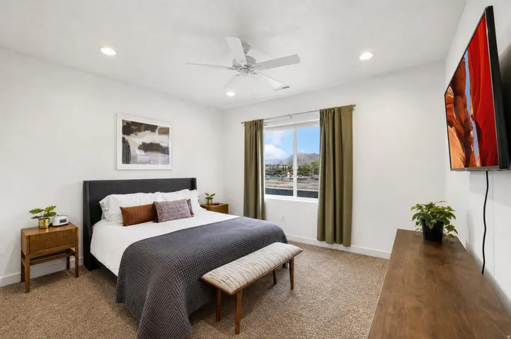 White walls with recessed lighting and a ceiling fan