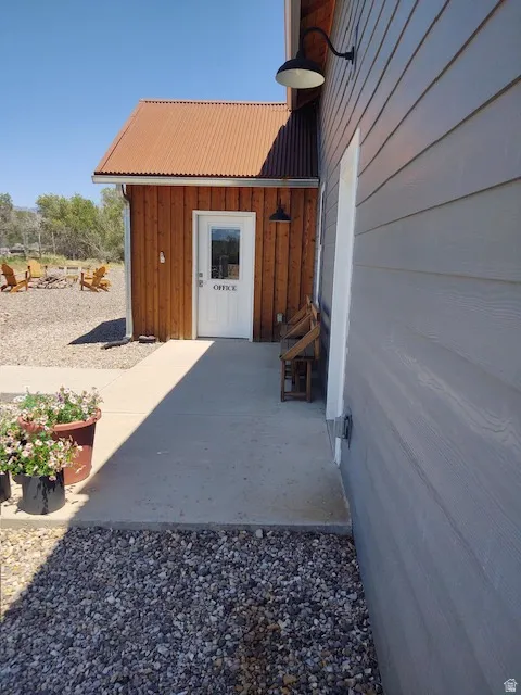Wood-sided building with a corrugated metal roof
