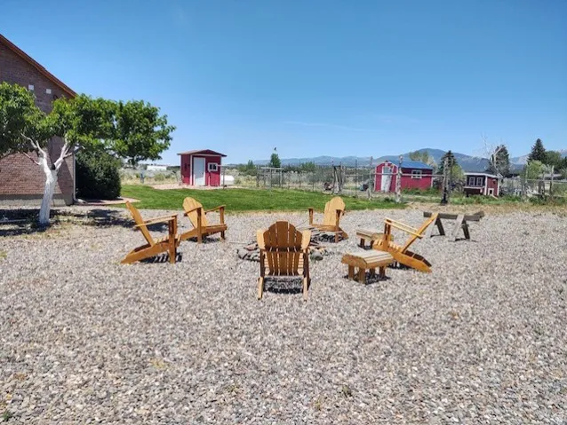 Gravel patio area featuring a fire pit
