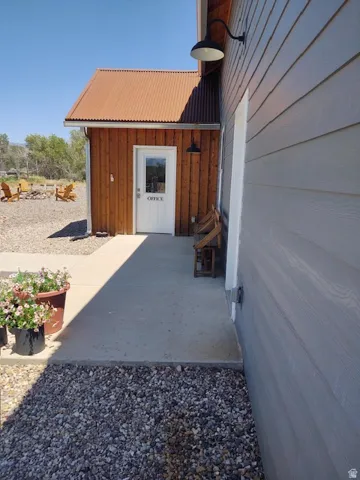 Wood-sided building with a corrugated metal roof