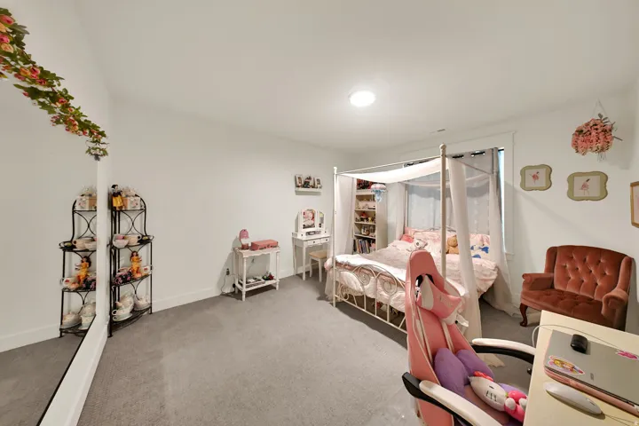 Recessed lighting, light gray carpeting, and white walls